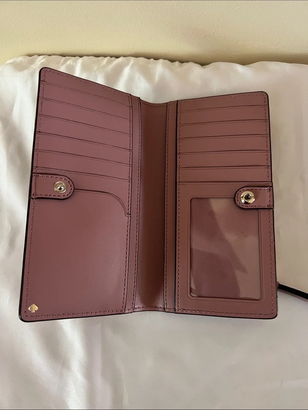kate spade leather continental wallet in muted rose brown